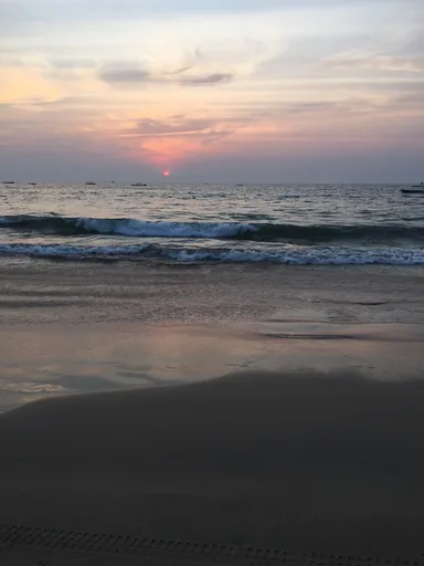 The sun setting over the Arabian Sea from a quiet beach in Goa.