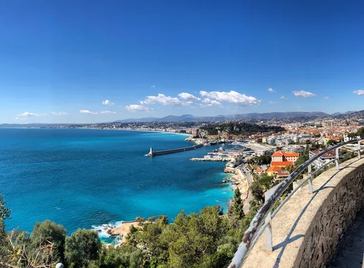 Turquoise water along the coast of Nice, seen from the hillside above the harbor.